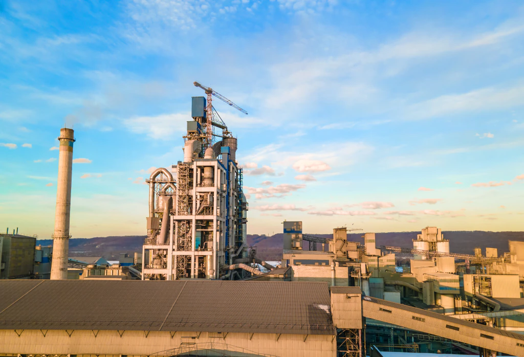 Cement plant tower under construction at sunset